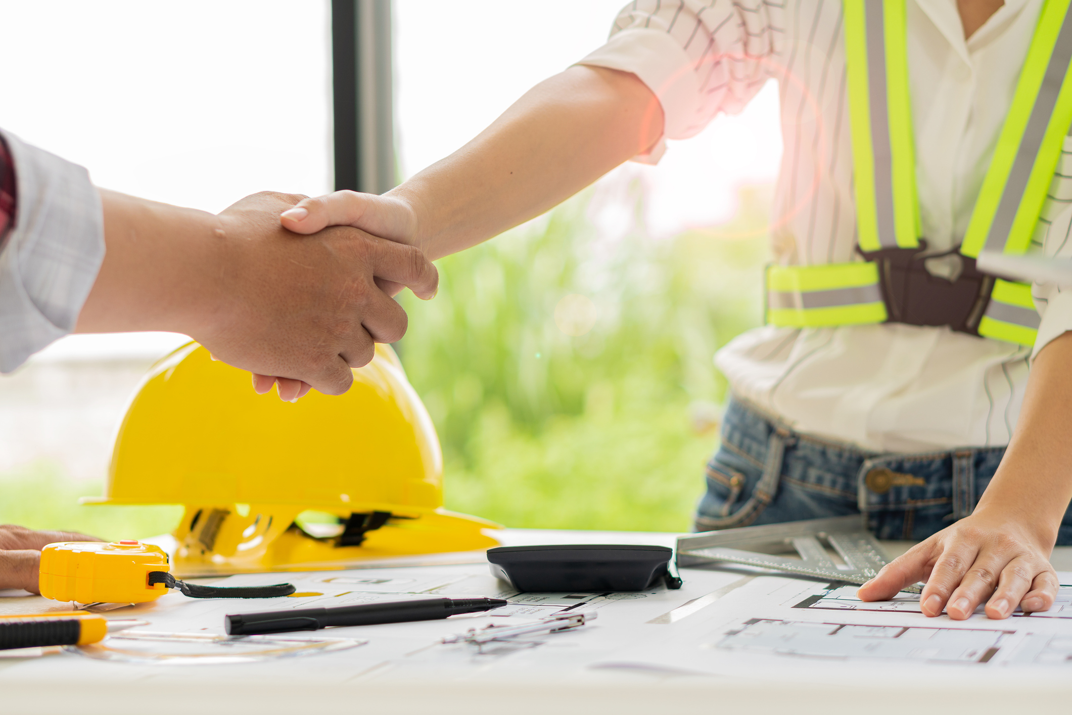 Professional architects and engineers join hands with workplace engineering objects that are committed to working on floor plans and building engineers who draft house designs in building construction